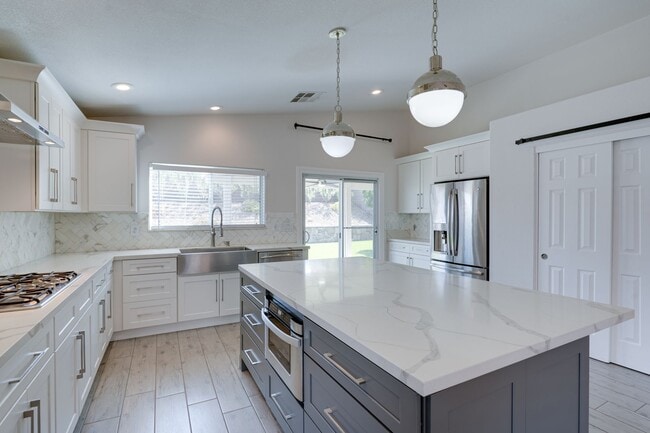 Building Photo - Comfort and Style in a Secure Gated Community: Stylish 4-Bedroom Single-Story Home