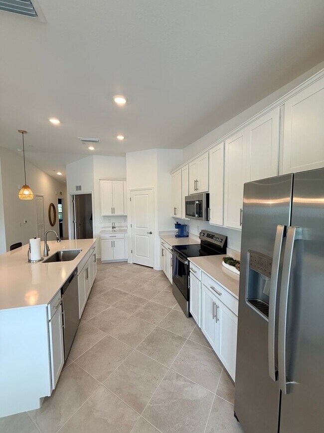 Building Photo - Beautifully Furnished Second-Floor Coach Home in the New Webb’s Reserve Golf & Country Club – Gol...