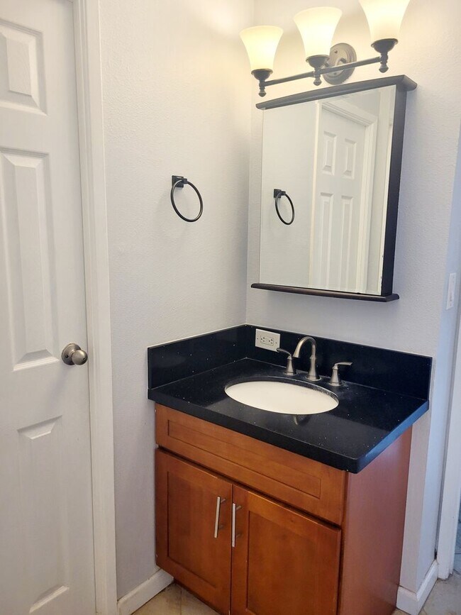 Building Photo - AVAILABLE | 2 Bedroom, 1 Bathroom Condo with 1 Assigned Parking Stall