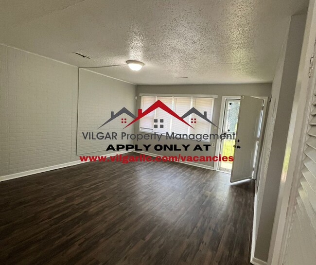Building Photo - Step into comfort and security in this bea...