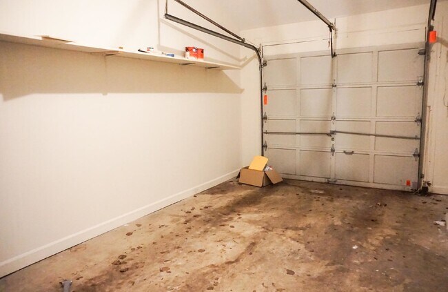 Building Photo - Beautiful brick townhome featuring three f...