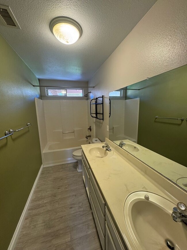 Building Photo - 4-Bedroom Home with Updated Kitchen and Co...