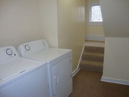 Steps to second floor from laundry area. - 522 E Market St