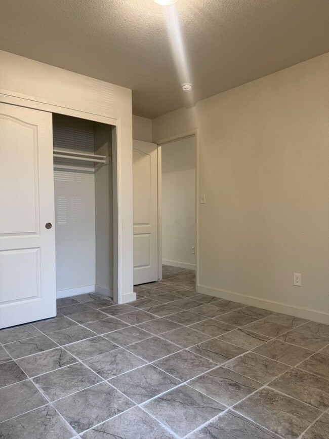 Building Photo - Available Now!!! With fresh paint and new ...