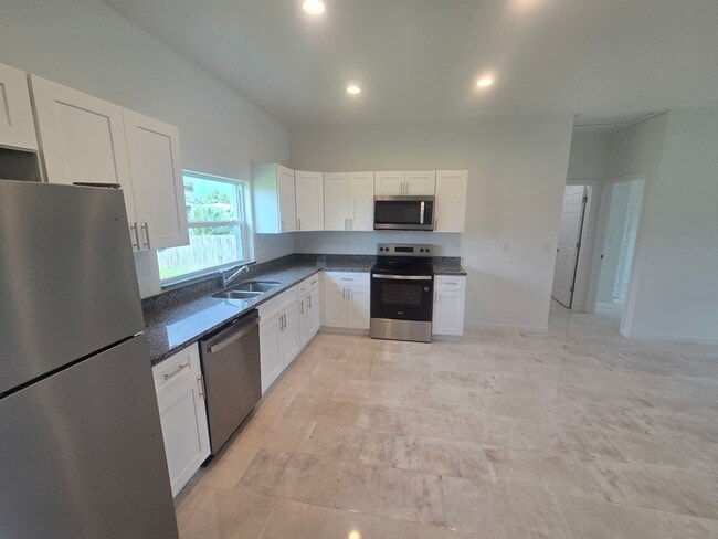Building Photo - Brand New 3 BEDROOM 2 BATH AND ONE CAR GAR...