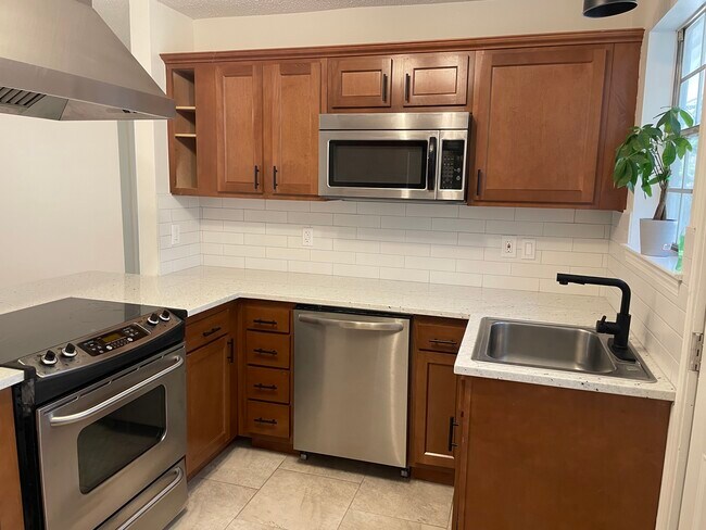 Newly Renovated Kitchen with all stainless appliances and dishwasher. - 218 W Saint Mary Dr