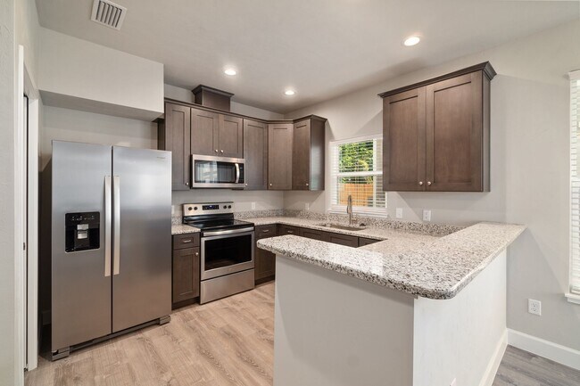 Building Photo - The Reef Townhome NOW LEASING FOR FALL 2026!