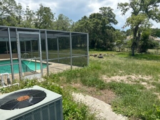 Building Photo - Large  3 bedroom, 2 bath pool home.