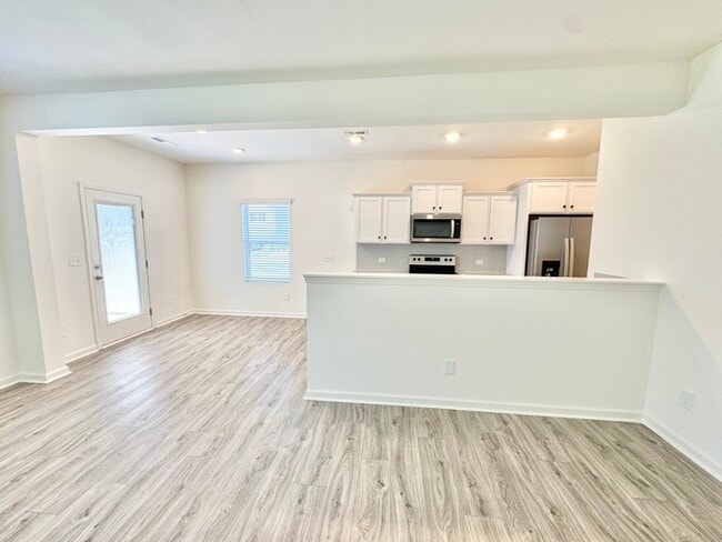 Building Photo - Three bedroom 2 1/2 bath paired home. Clos...
