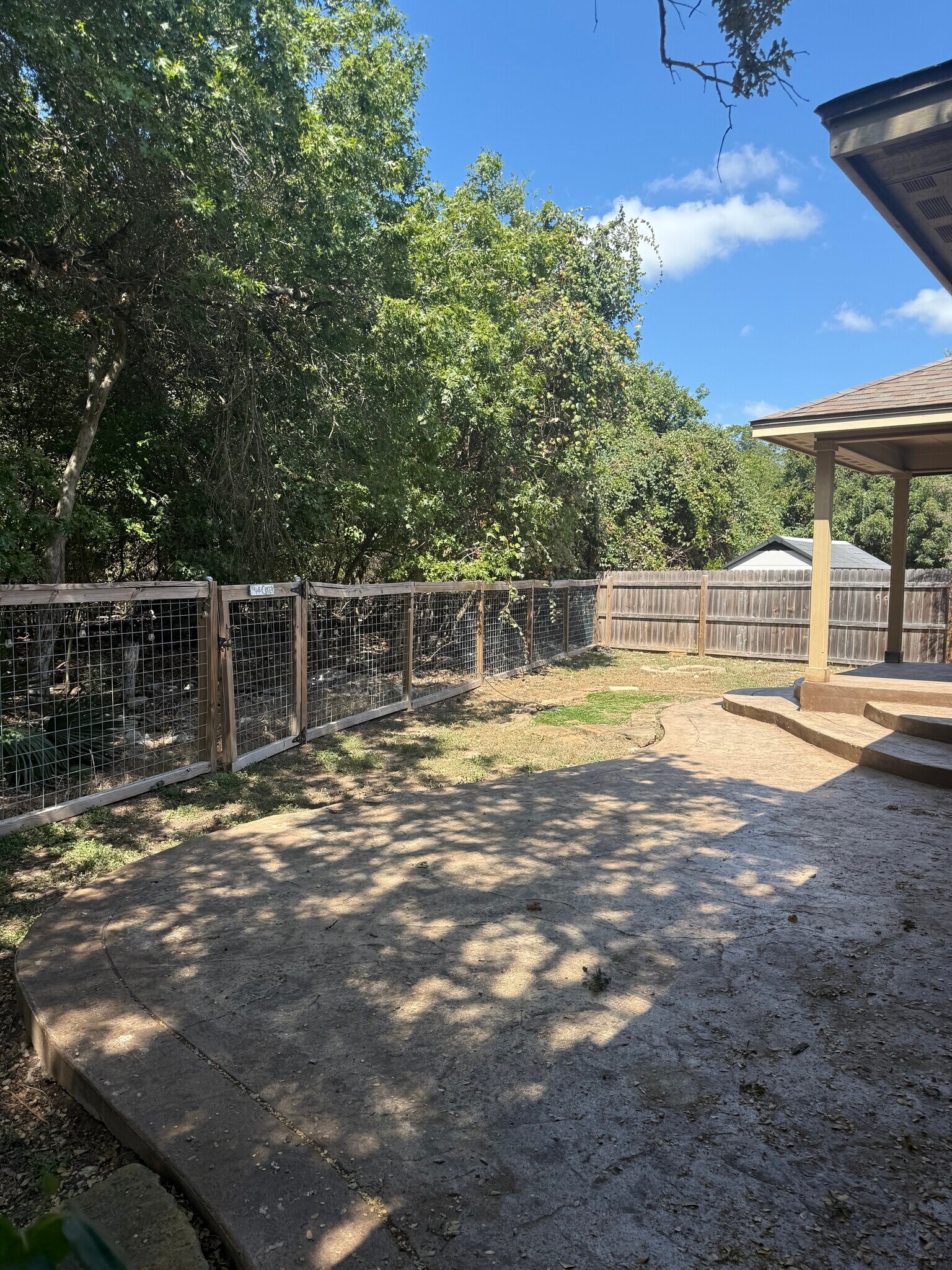 Backyard covered concrete patio - 15327 English River Loop