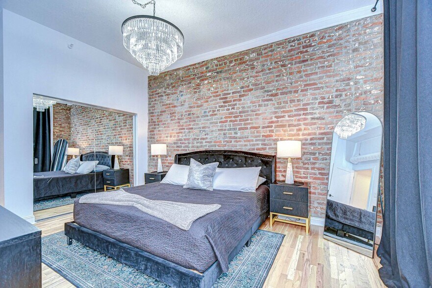 The master bedroom features a king size bed, large closet and bathroom ensuite - 215 Central Ave