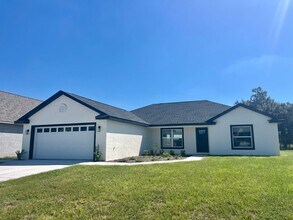 Building Photo - Stunning Brand-New 3BR/2BA Bushnell Block ...