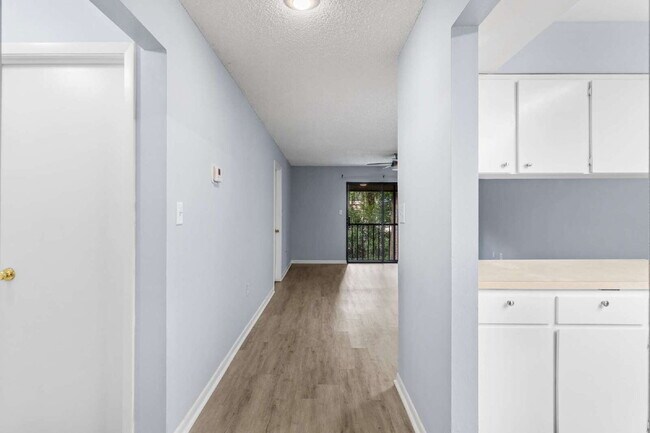 Building Photo - Freshly Updated 2BR Condo with Private Balcony, Community Pool, & In-Unit Laundry