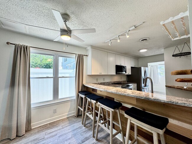 Building Photo - Ready NOW! A Custom Townhouse-Style Duplex Blocks to the Beaches! Fenced Yard - Hot Tub - Pet Fri...