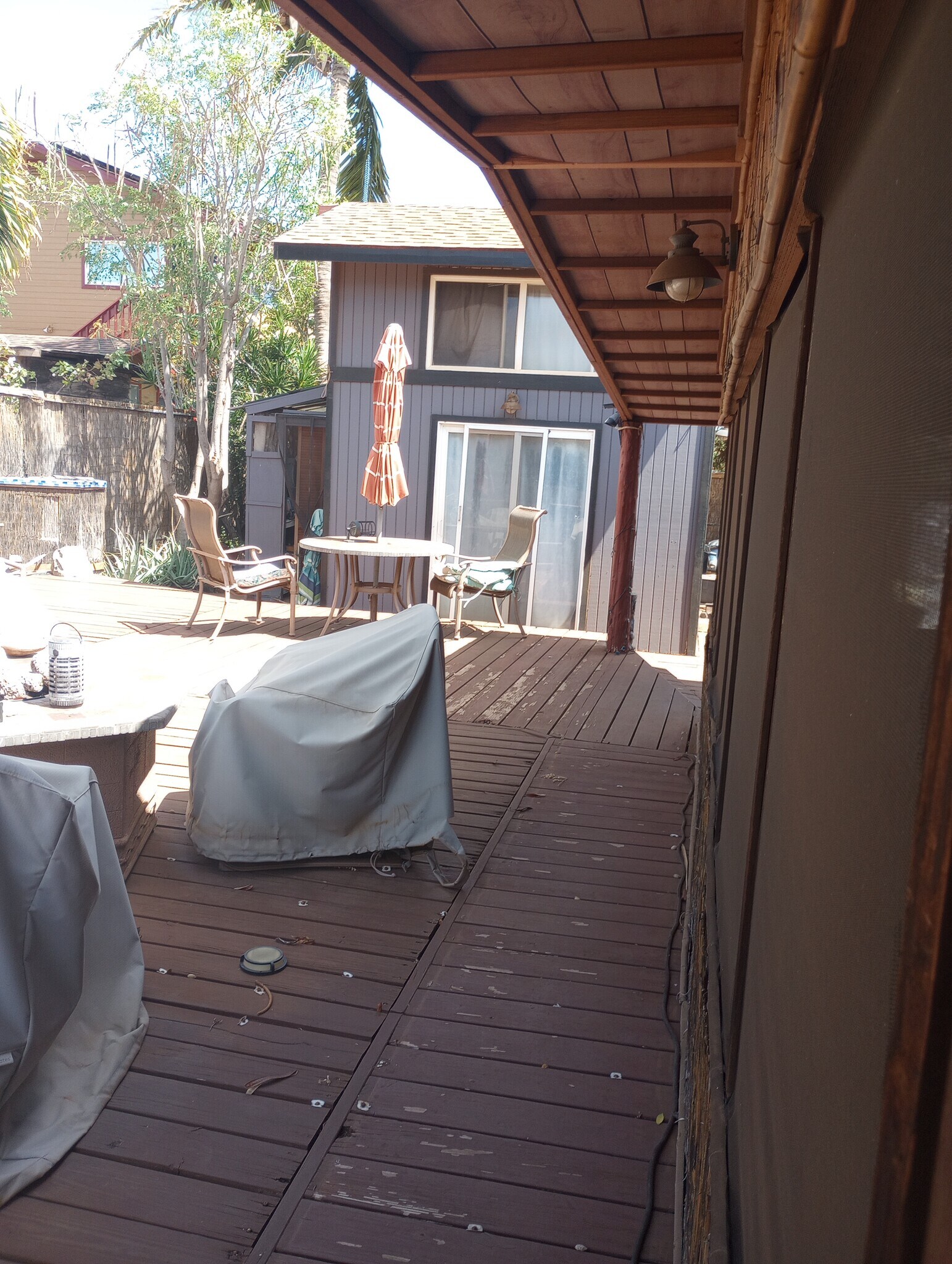 walking back from Bathroom, under Lanai overhang. (Tiny side slider shown in pic) - 281 Kaikea St