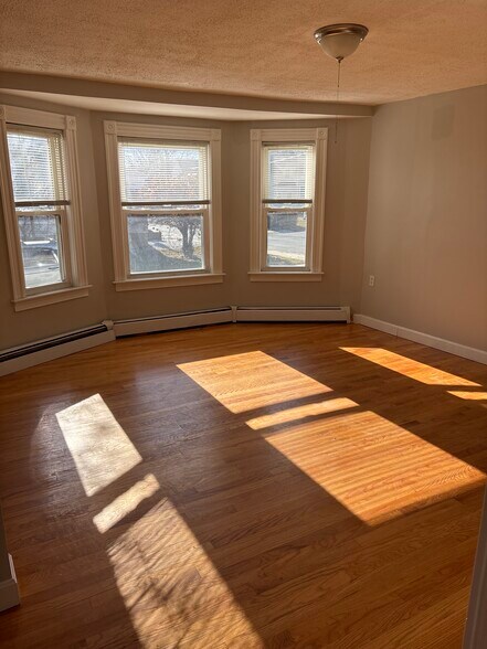 Living room with plenty of natural sunlight - 27 Elm St