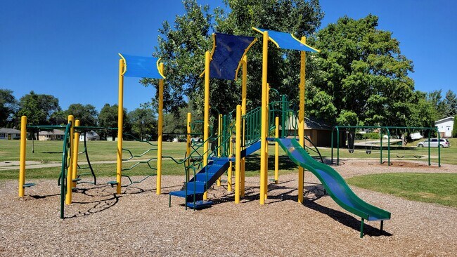 Playground area at Forest Park. You will find many people walking their dogs in this neighborhood. - 6305 49th Ave
