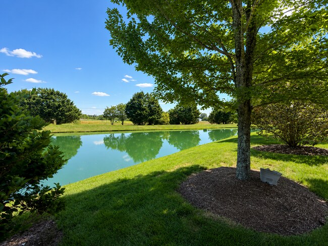 Building Photo - Beautiful 3-Bedroom Townhome with Pond View | Lawn Care Included | Convenient Whitsett Location