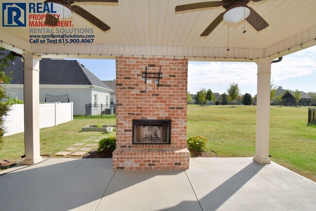Building Photo - All brick 4 bedroom home plus Bonus room! Garage and covered patio!