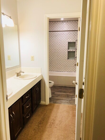 Double sinks and separate door the shower/toilet room make this bathroom easy for multiple people to use at once. A huge closet provides tons of linen storage as well. - 3 Tyrol Ct