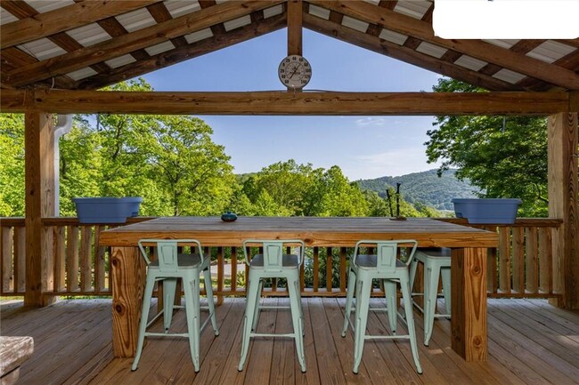 View From front deck with table and gas fireplace - 511 Leon Coffey Rd