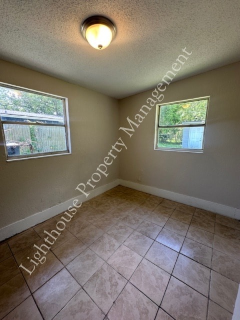 Building Photo - Bright 4 Bedroom Home With Tile Flooring Throughout
