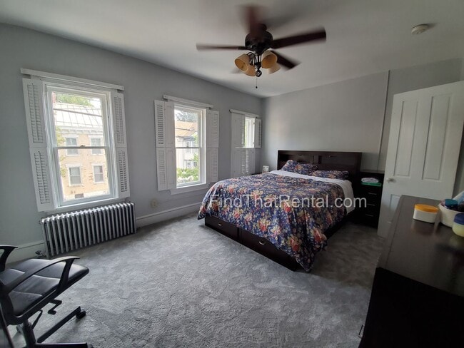 Building Photo - Charming Historic Retreat with Private Fenced Yard & Parking – Prime Downtown Location