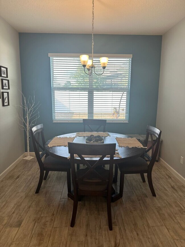 Building Photo - Welcome to this inviting 3/2 single family home located in Compass Landing