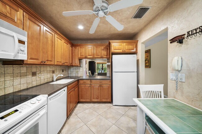 Building Photo - 21669 Tall Palm Cir