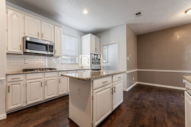 Building Photo - Recently Updated Plano Property with Modern Features and Serene Surroundings