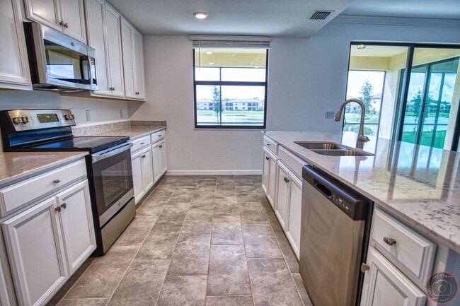 Building Photo - Annual Unfurnished Rental – New Construction Coach Home 3 Bedrooms, 2 Baths, 2 Car Garage, with R...
