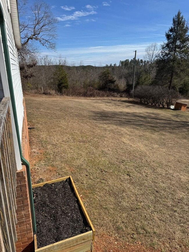 Building Photo - Spacious 4-Bedroom Rural Home on Private Acreage