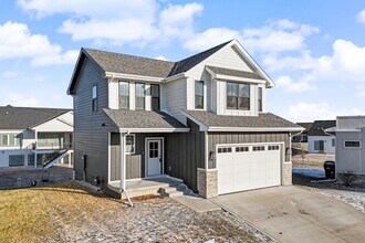 Building Photo - Spacious 4-Bedroom Home with 2-Car Garage & Yard