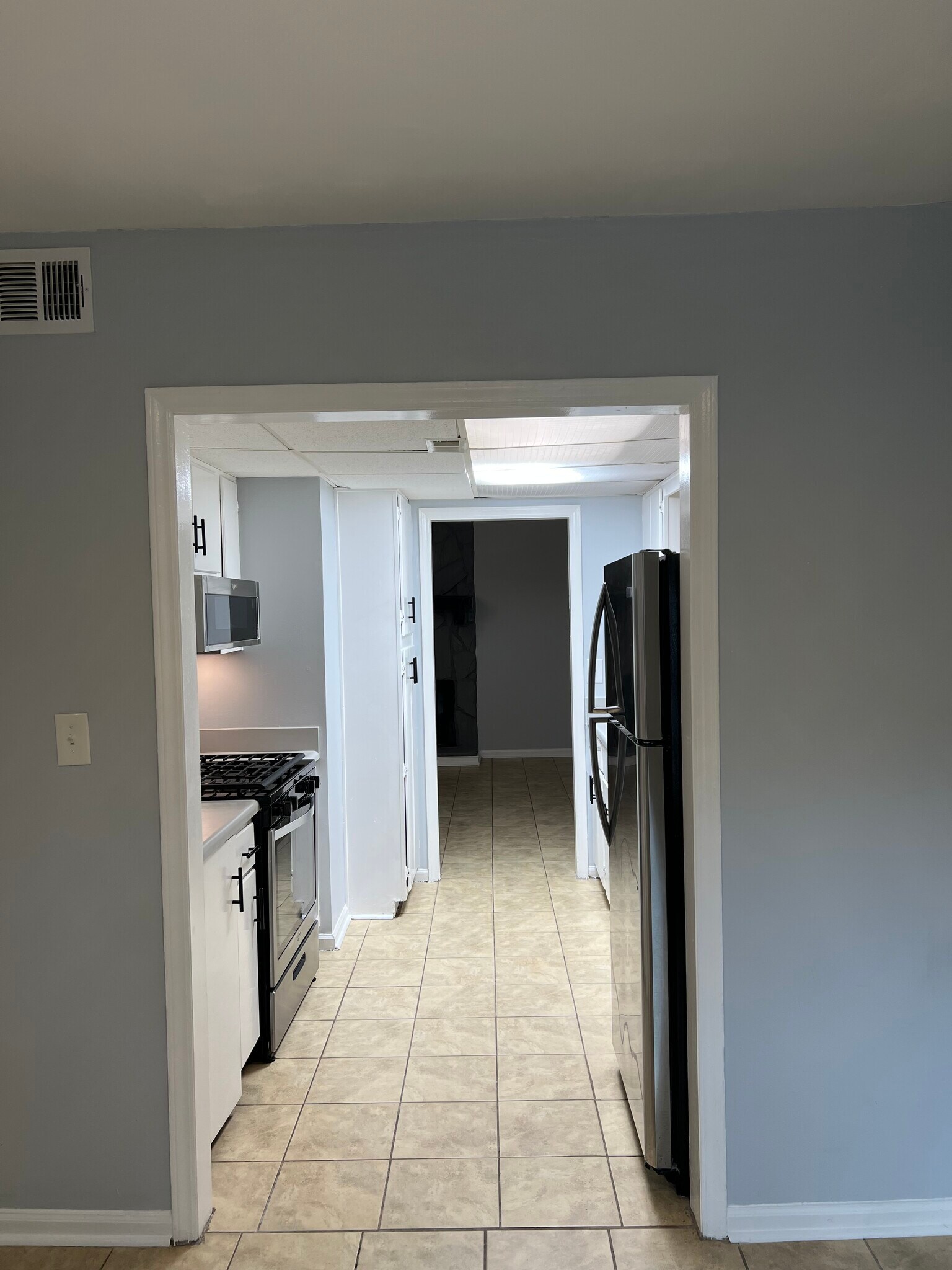 Direct view from dinning through kitchen and living room - 6419 Baker Ct