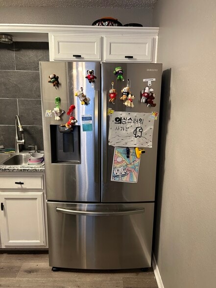 New Frige with freezer on the bottom and water on the door. - 1307 Bagby Ave