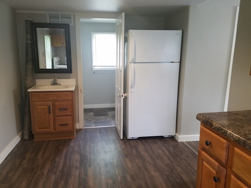 Kitchen includes refrigerator - 103 12th W St