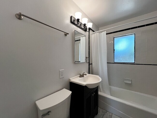 Building Photo - Freshly Renovated 3 Bedroom Home with Large Fenced Yard & Double Garage