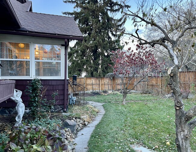 Alternate view of side gate entry, fenced yard. - 1401 W 13th Ave