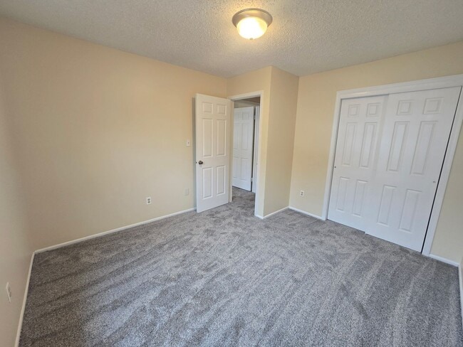 Building Photo - Recently painted & carpeted townhouse with 1,200+ SQ FT, 3-bedroom, 2.5 bathroom and lots of amen...