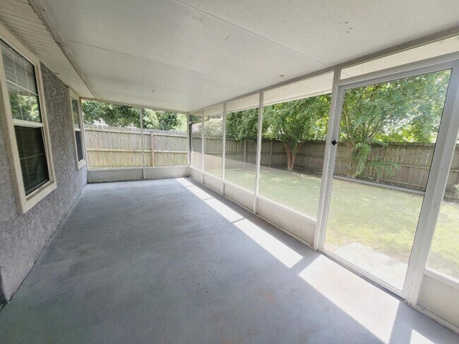 Building Photo - LOVELY 3/2 w/ Screened Porch, New Carpet in Bedrooms, Washer/Dryer, & Privacy Fenced Yard! Includ...