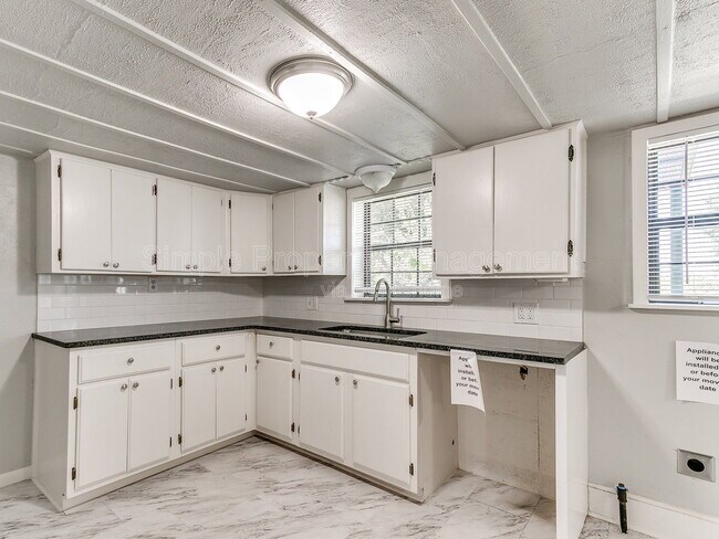 Building Photo - 9706 N Garnett Dr