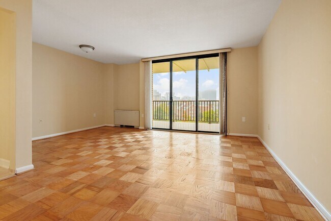 Building Photo - Spacious, and Sunlit 1 BD/1 BA Condo w/Reserved Garage Parking and Utilities Included in Chevy Ch...