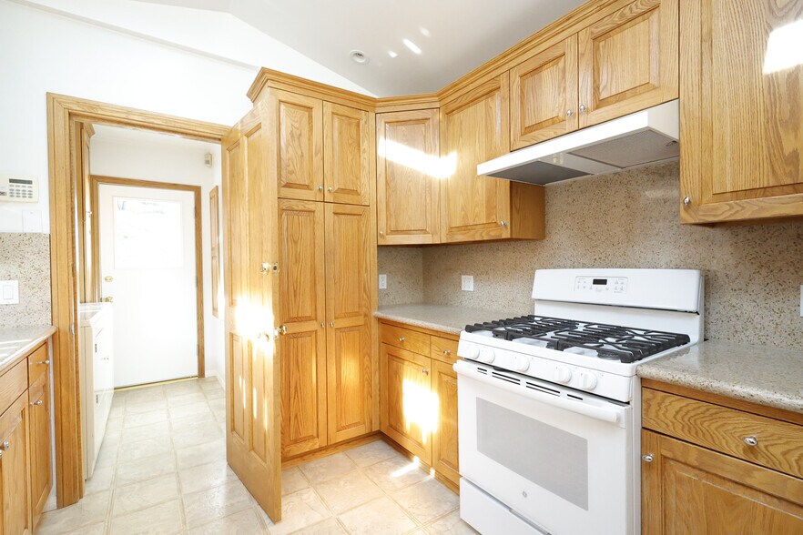 Bright kitchen with double skylights above bringing lots of natural light. - 4831 Canoga Ave