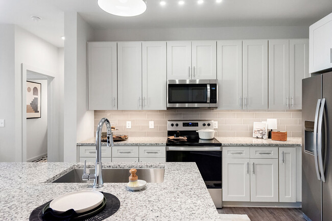 Custom Cabinetry with Under-Cabinet Lighting, Designer Hardware, and Tile Backsplashes - Cortland Wren Northlake