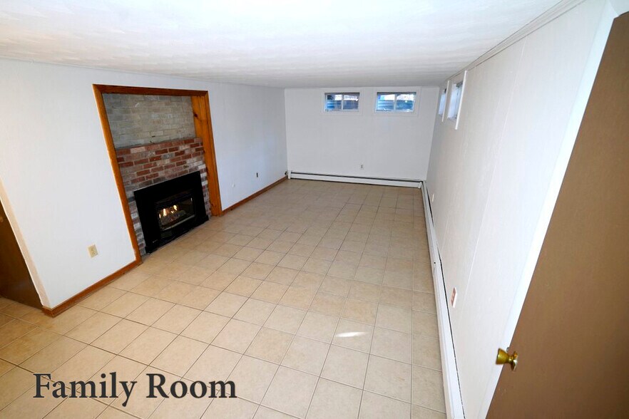 Basement family room with gas fireplace - 208 Grove St