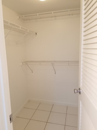 Walk-in bedroom closet - 604 NW 13th St