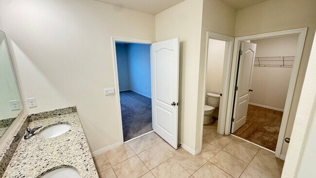 Building Photo - Available NOW! Spacious 4BD/2BA Haven in Villages at Harmony – Your Dream Home Awaits! WASHER & D...