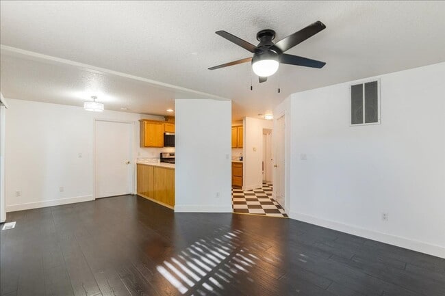 Building Photo - Versatile 4-Bedroom Corner Condo with Main...