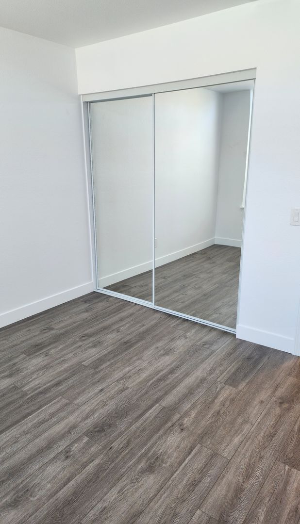 Building Photo - Gorgeous 2 bedroom newly renovated upstairs corner condo in gated community with pool & hill side...