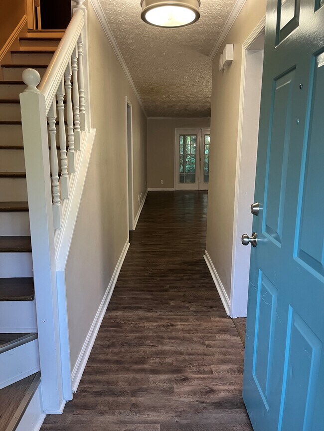 Front entry with view to dining & living room, stairs to left, kitchen to right - 440 Williamsburg Way